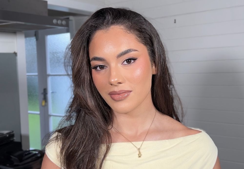 Glowing glam makeup with a soft winged liner and glossy nude lip